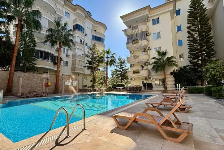 Spacious furnished apartment with a pool and city views in Cikcilli, Alanya