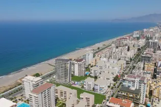 Luxury apartments in a project under construction in Mahmutlar – 50 meters from the sea