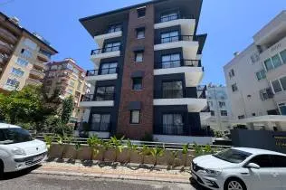 A modern 1+1 apartment with swimming pools and a fitness center in the city center, just 250 meters from the sea